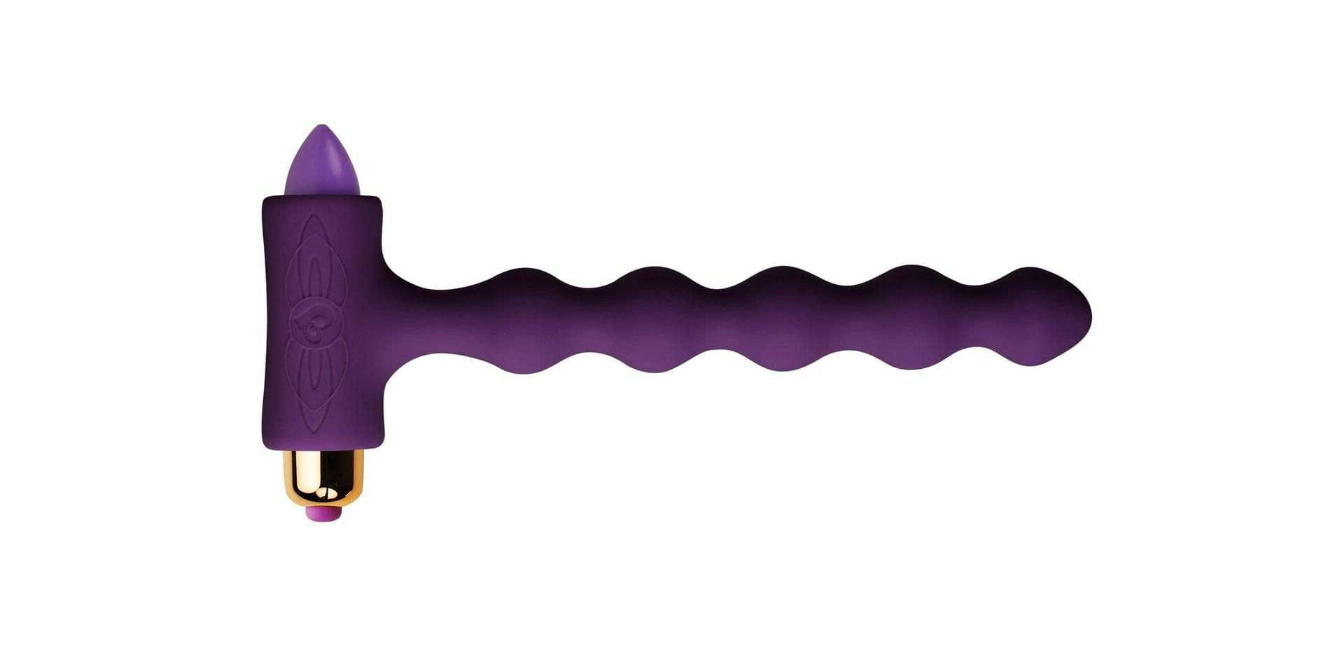 Фиолетовый рельефный анальный стимулятор.